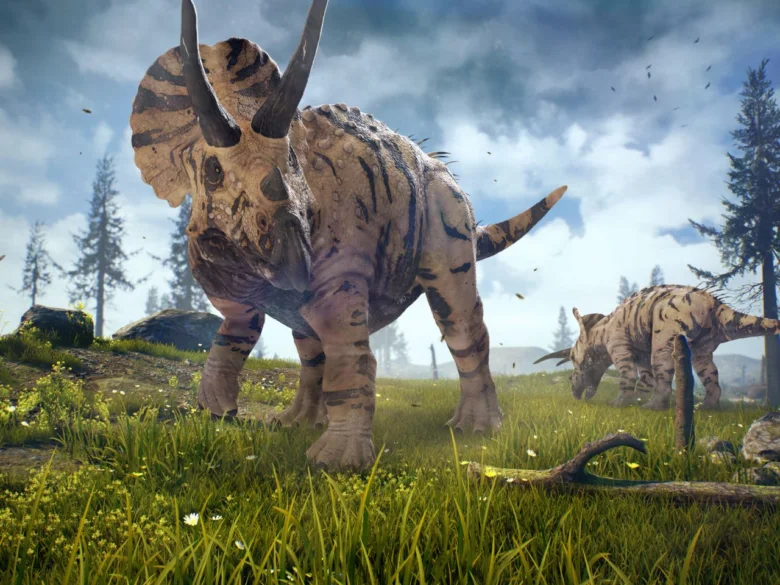 Dva triceratopové dinosaury stojí na trávnaté louce s stromy.